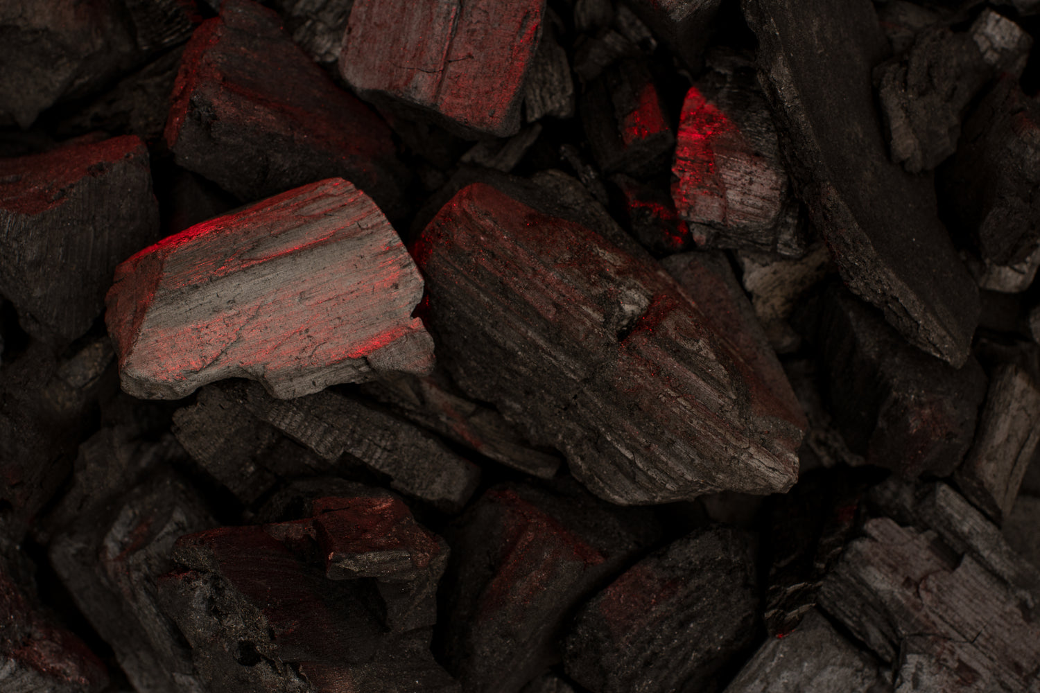 smoldering charcoal with red hot coals
